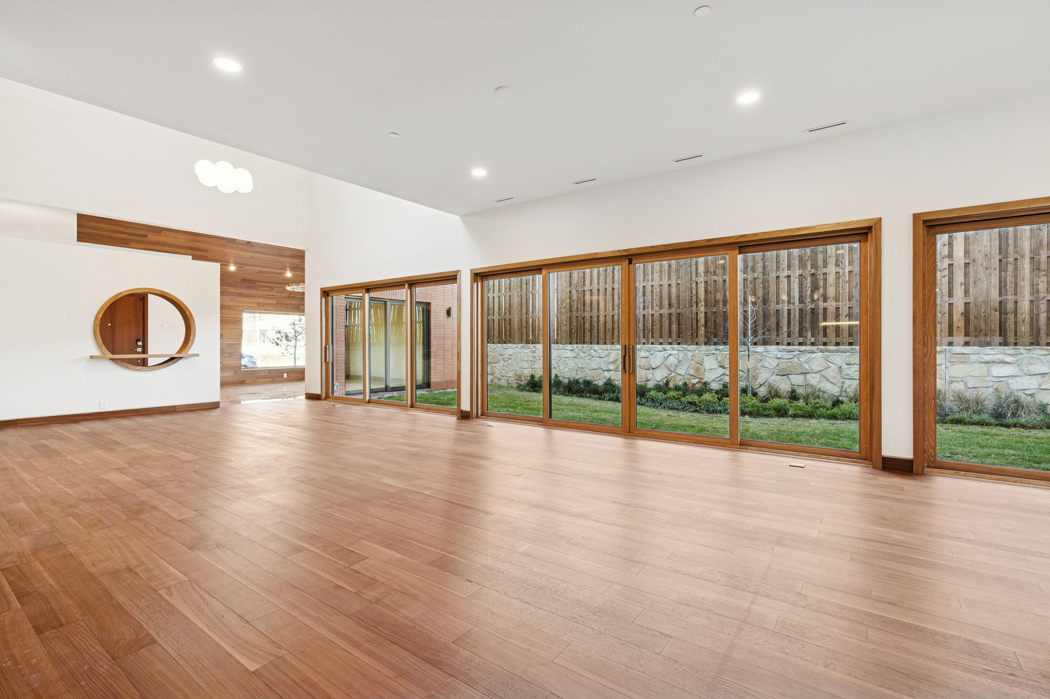 14867 Little Bluestem Ln - living area with floor-to-ceiling glass doors