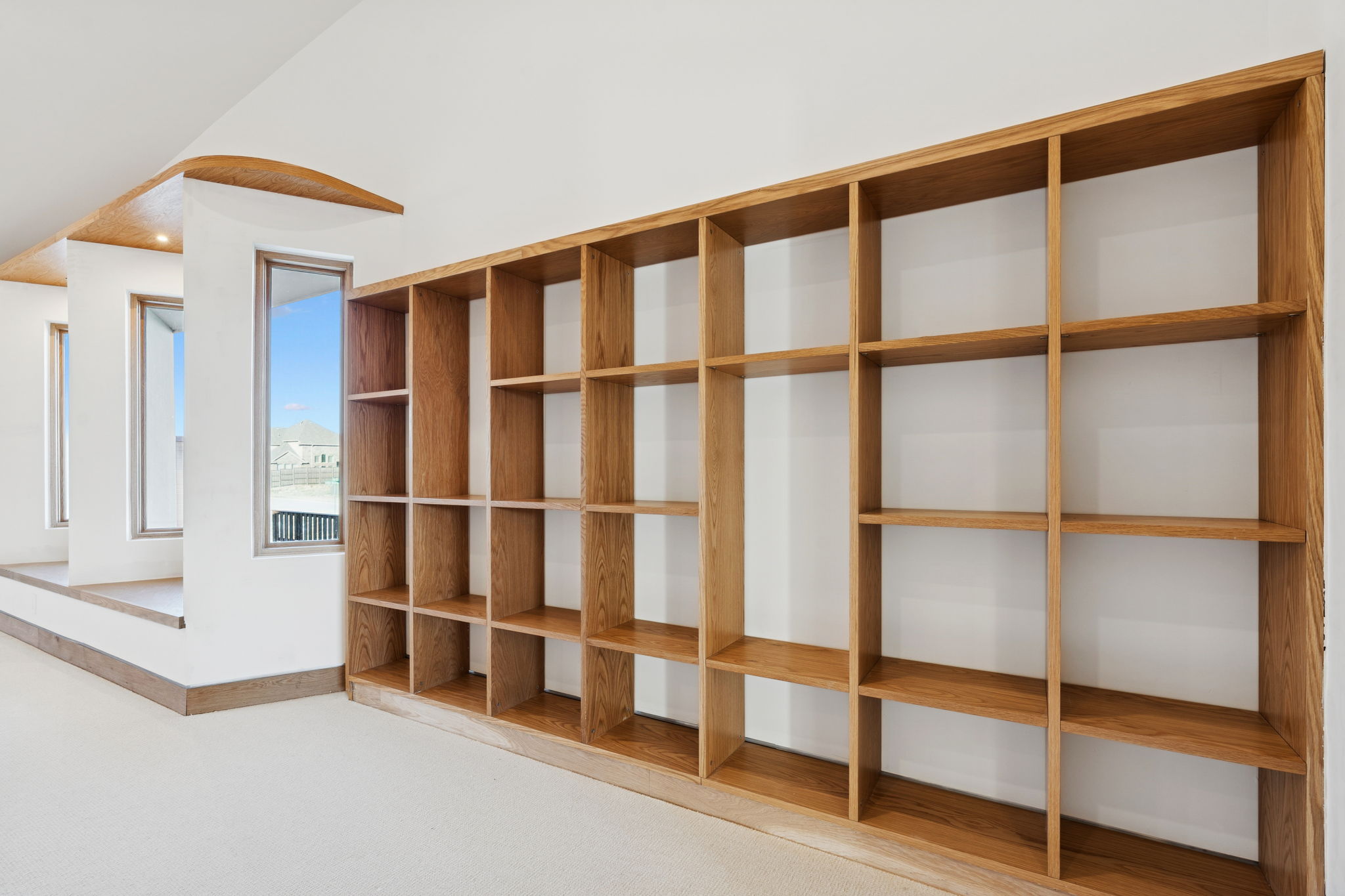 14867 Little Bluestem Ln - built-in oak bookshelf wall